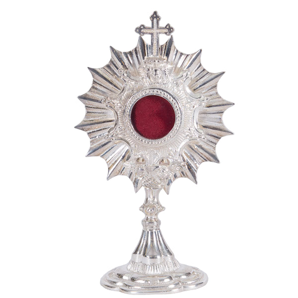 Silver plated Ray of Light reliquary with round glass opening and removable back door.