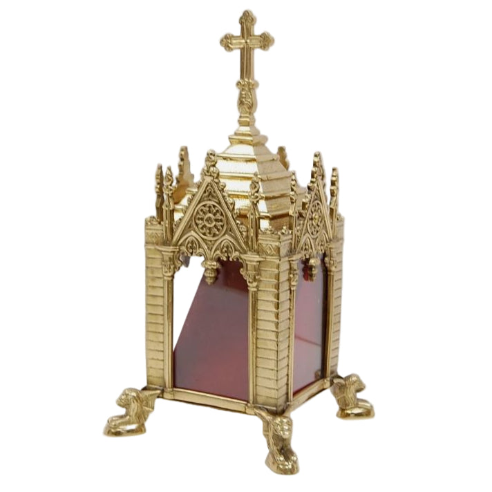 A traditional Gothic style brass relic shrine with a polished finish, cross on top. Clear glass on all four sides. Removable top to display your relics.