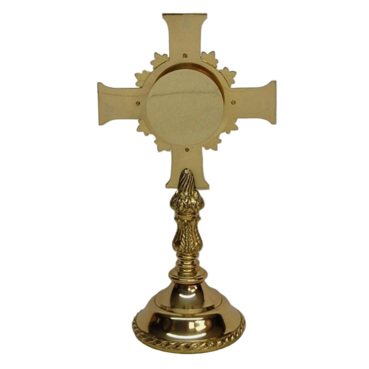 Brass cross-shaped reliquary with a polished finish and a relic compartment visible at the top. Removable back door