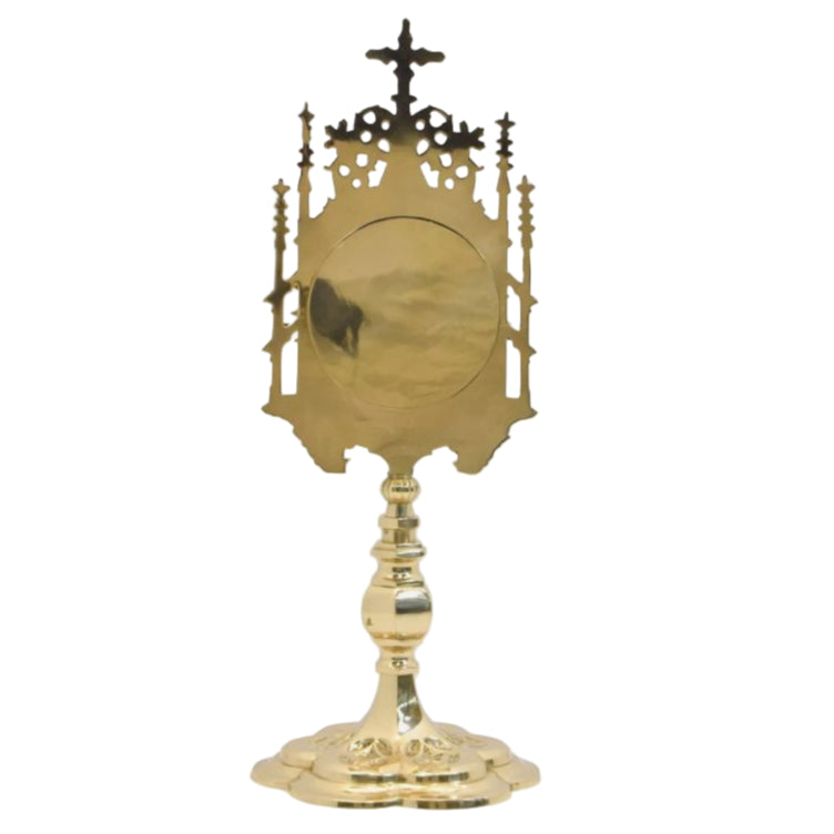 Gold plated reliquary with a large view window presented in gothic style.