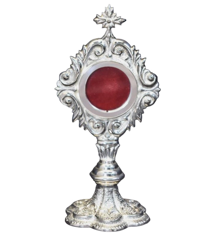 Silver plated French style reliquary with a round relic compartment and a glass front. Front View
