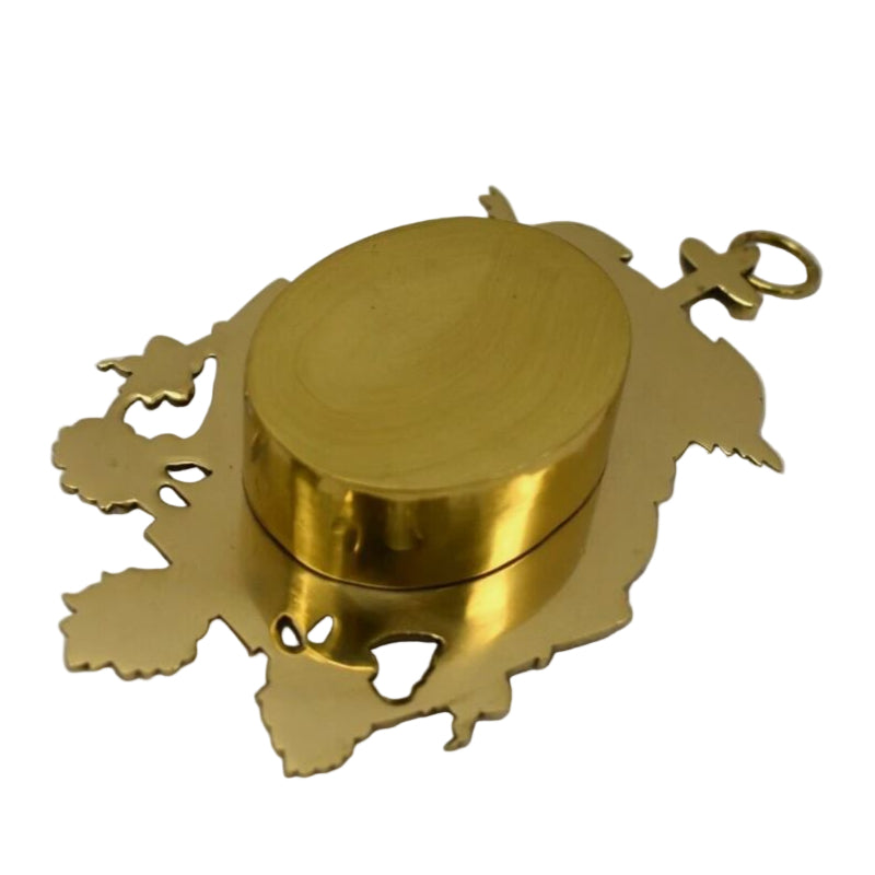 A polished brass and lacquered gold hanging reliquary with a front glass view and a relic compartment, featuring intricate architectural details. Has a hook on the top for wall hanging.
BACK VIEW