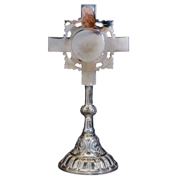 Silver Plated cross shaped reliquary with glass on the front and a removable back door. BACK VIEW SHOWING DOOR