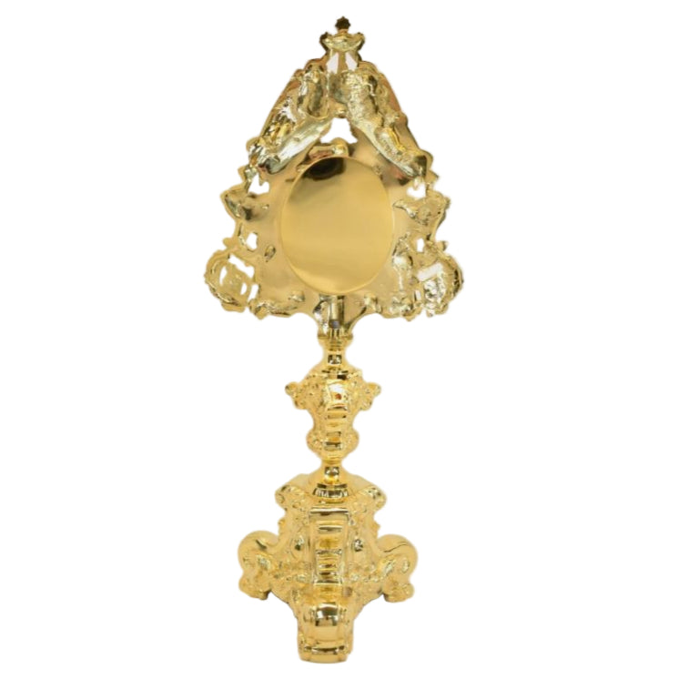 Gold plated reliquary with 2 adoring angels on the top. Glass on the front, oval relic compartment with removable back door. BACK VIEW
