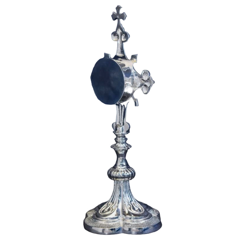 Silver plated French style fleur de lis cross reliquary with a clear front glass and removable back door.
