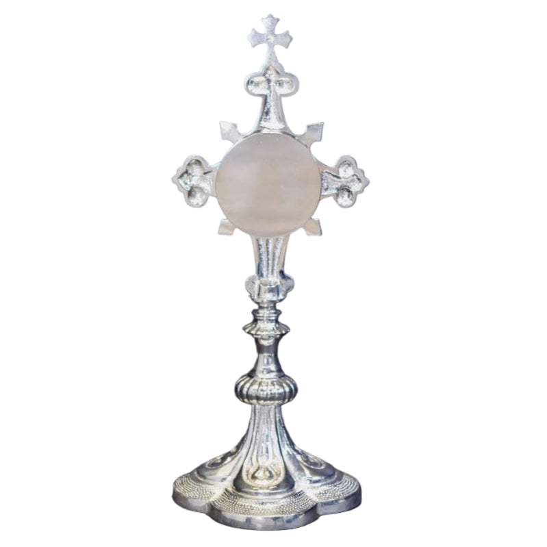 Silver plated French style fleur de lis cross reliquary with a clear front glass and removable back door.