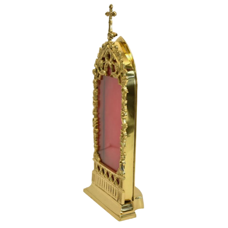 gold plated relic house with a large glass opening on the front and red velvet wall on the back. Door is removable. Can fit multiple relics inside.