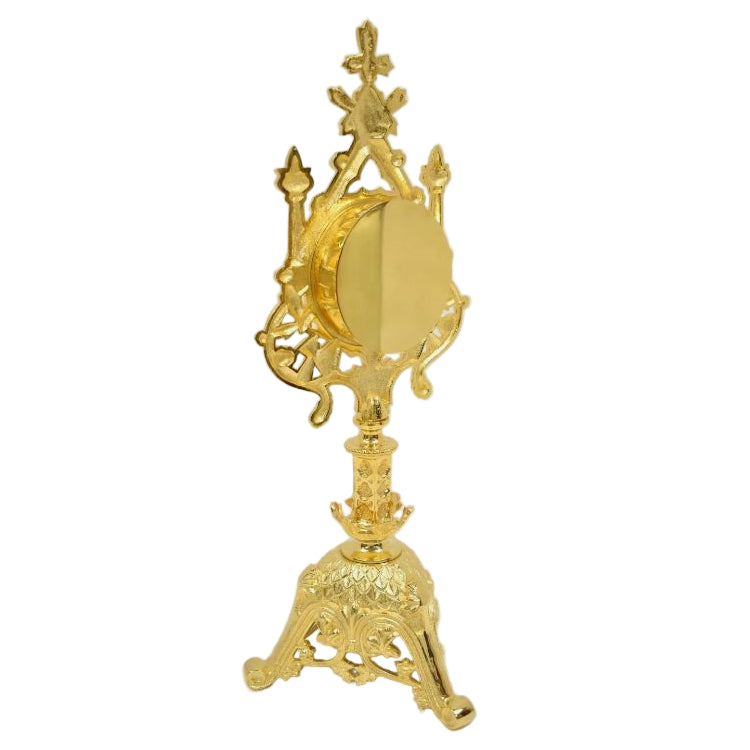 Gold plated traditional reliquary with a large front glass and a triangular base, designed for holding relics. Side view showing removable back door