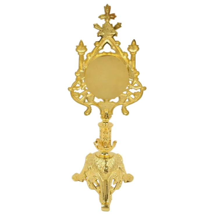 Gold plated traditional reliquary with a large front glass and a triangular base, designed for holding relics. Back door is removable