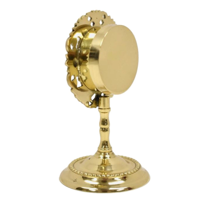 Small brass reliquary with glass opening and removable back door.