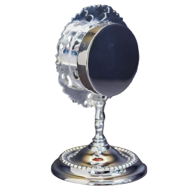 Small silver plated reliquary with round glass front and removable back door. To display your relic.