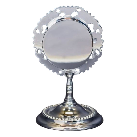 Small silver plated reliquary with round glass front and removable back door. To display your relic.