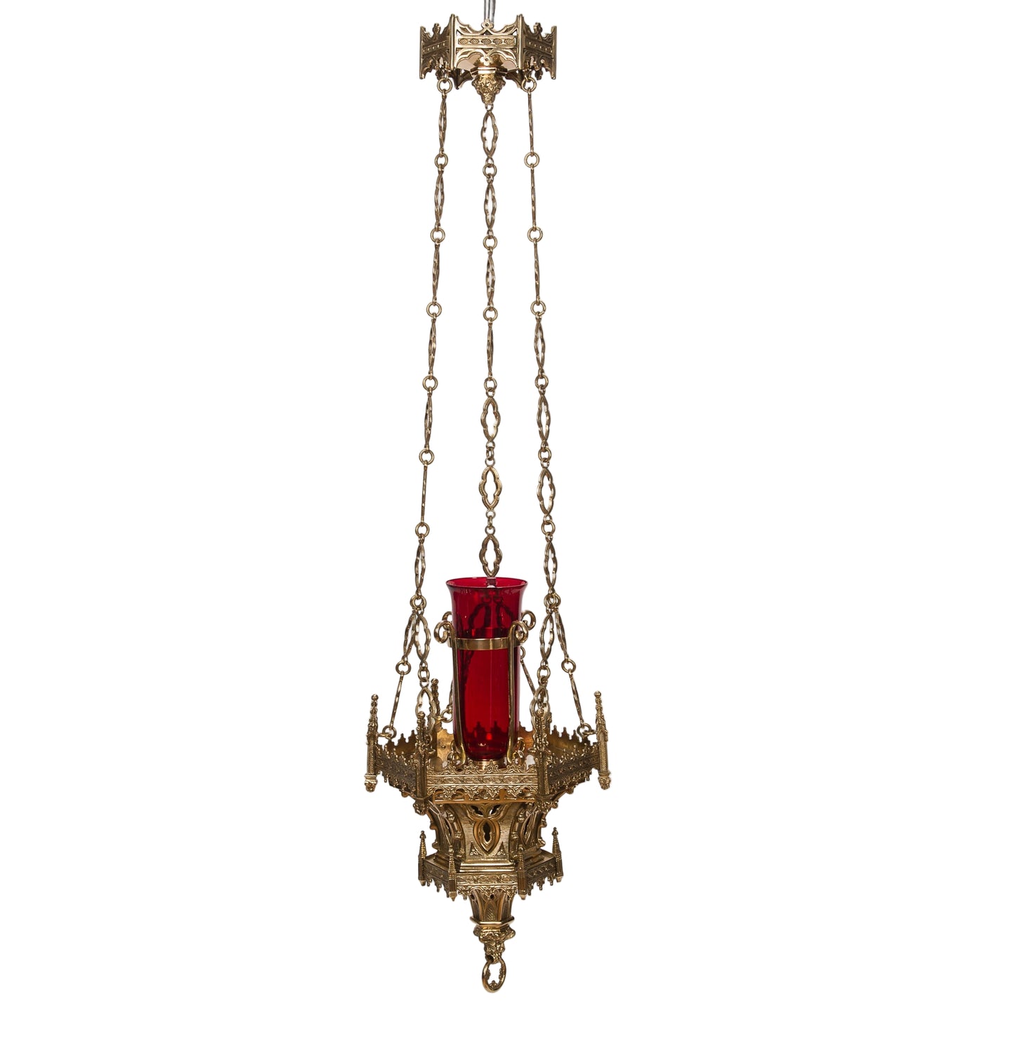 A hanging sanctuary lamp with a polished brass and lacquered finish, featuring a red globe, ornate design, and chains.