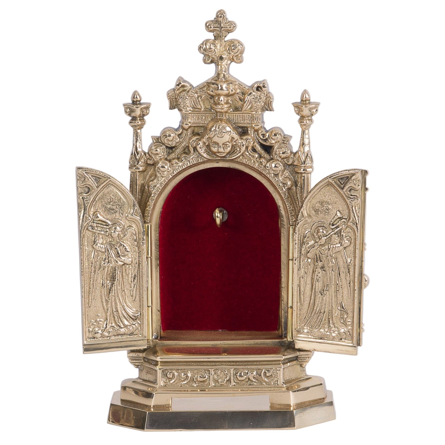brass triptych reliquary with 2 doors that open and close to reveal your relic hanging from the hook inside. Ornate filgree with angels on the door.
SHOWN HERE WITH THE DOORS OPEN