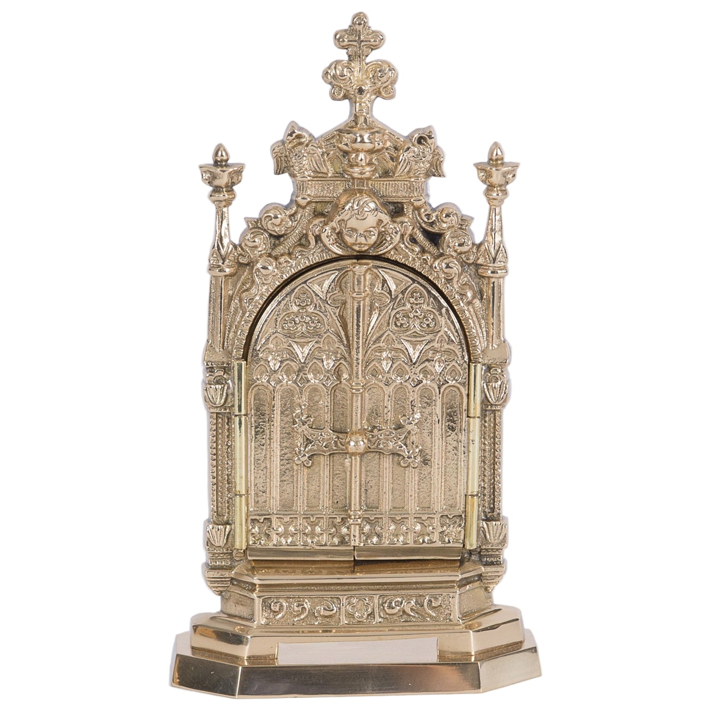 brass triptych reliquary with 2 doors that open and close to reveal your relic hanging from the hook inside. Ornate filgree with angels on the door.
SHOWN HERE WITH THE DOORS CLOSED