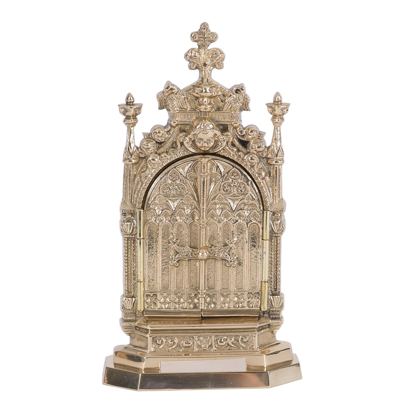 gold plated triptych reliquary with 2 doors that open and close to reveal your relic hanging from the hook inside. Ornate filgree with angels on the door.
SHOWN HERE WITH THE DOORS CLOSED