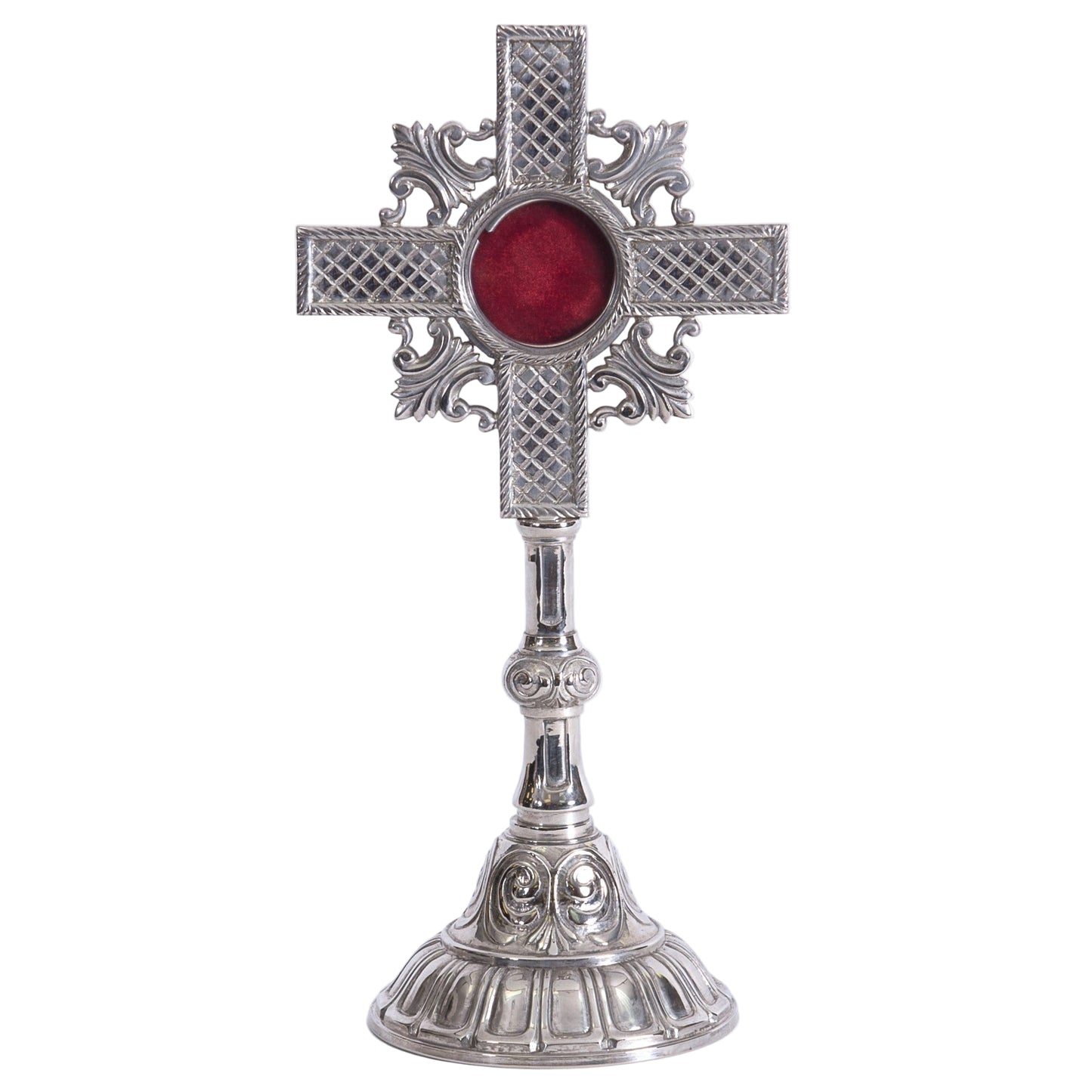 Silver Plated cross shaped reliquary with glass on the front and a removable back door.