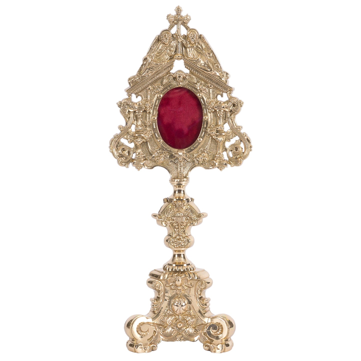 Large Ornate polished brass and lacquered reliquary. 2 Angels perched on top holding the cross. Baroque style base. Glass on front with an oval shaped relic compartment.