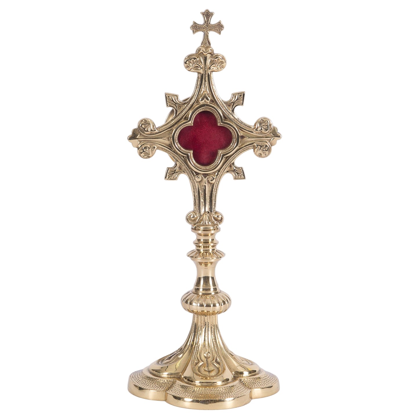 Ornate quatrefoil shaped reliquary. Polished brass and lacquered. Floral shaped glass opening with removable back door.