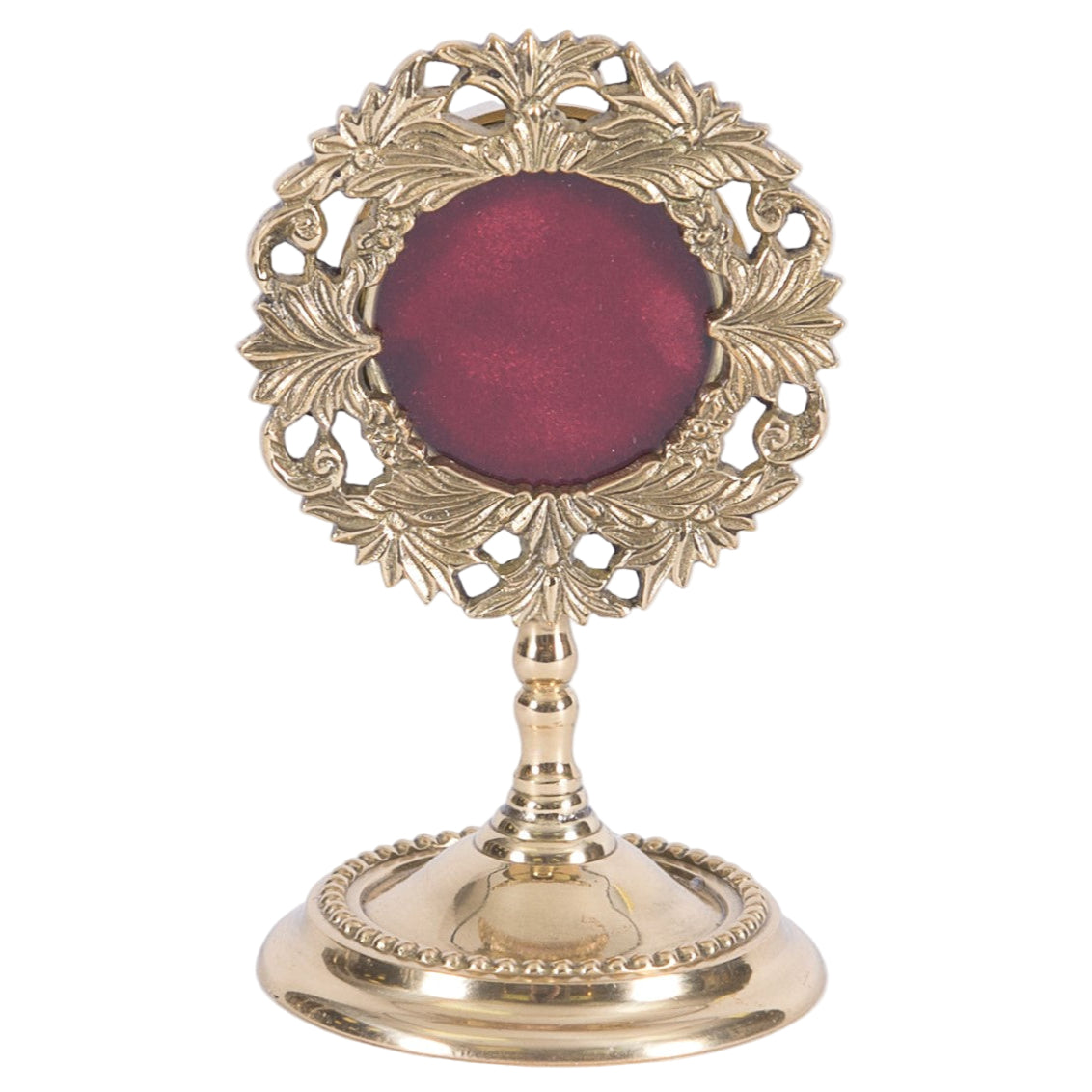 Small brass reliquary with glass opening and removable back
