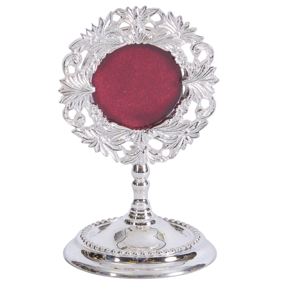 Small silver plated reliquary with round glass front and removable back door. To display your relic.