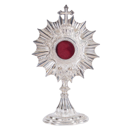 Silver plated Ray of Light reliquary with round glass opening and removable back door. 