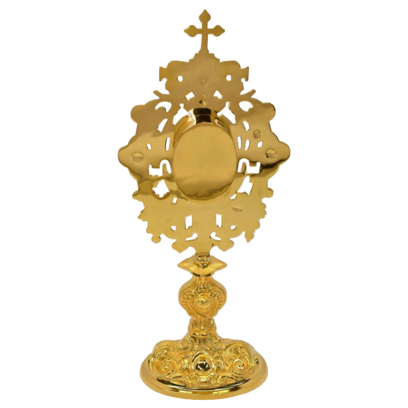 back side of ornate gold plated reliquary with oval opening