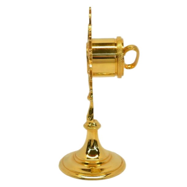 Gold plated brass veneration reliquary with a round glass relic compartment at the top. Handle on the back for easy veneration use. All gold plated over brass. 
SIDE VIEW SHOWING HANDLE ON BACK