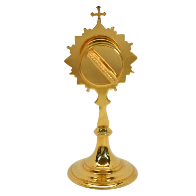 Gold plated brass veneration reliquary with a round glass relic compartment at the top. Handle on the back for easy veneration use. All gold plated over brass. 
BACK VIEW SHOWING HANDLE