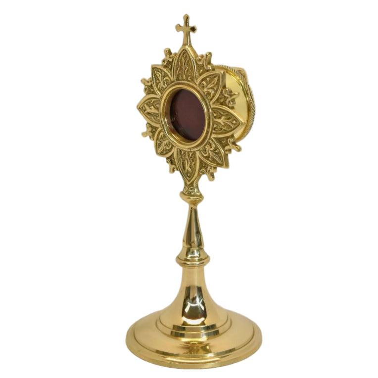 Polished brass and lacquered ornate French style reliquary with a handle on the back for veneration. Glass on front and removable back door to house your relic. SIDE ANGLE VIEW