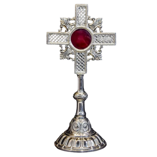 Silver Plated cross shaped reliquary with glass on the front and a removable back door.