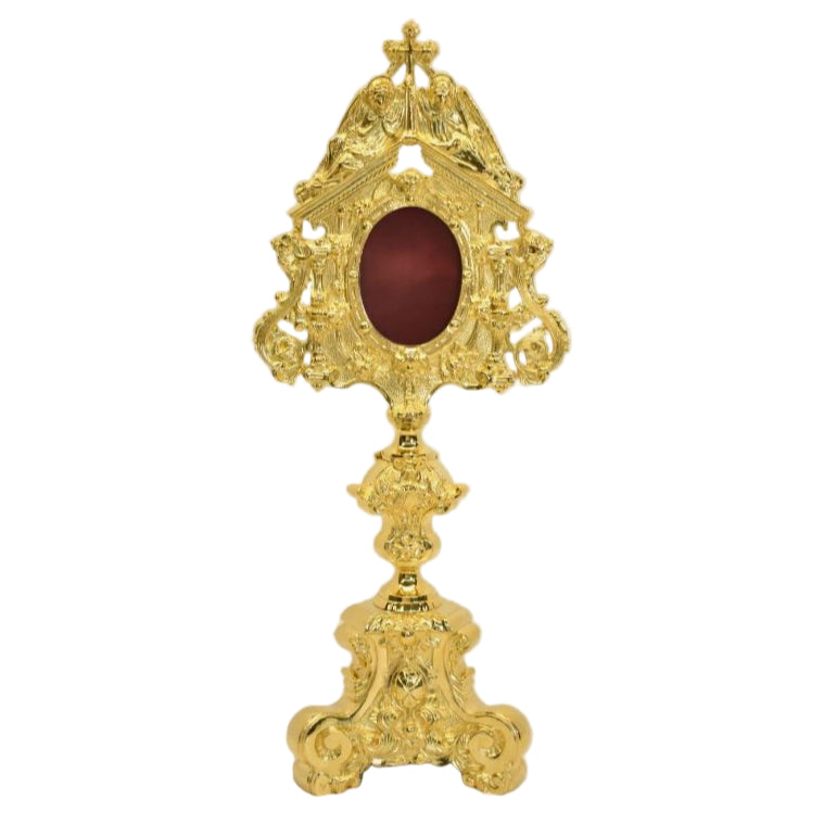 Gold plated reliquary with 2 adoring angels on the top. Glass on the front, oval relic compartment with removable back door. FRONT VIEW