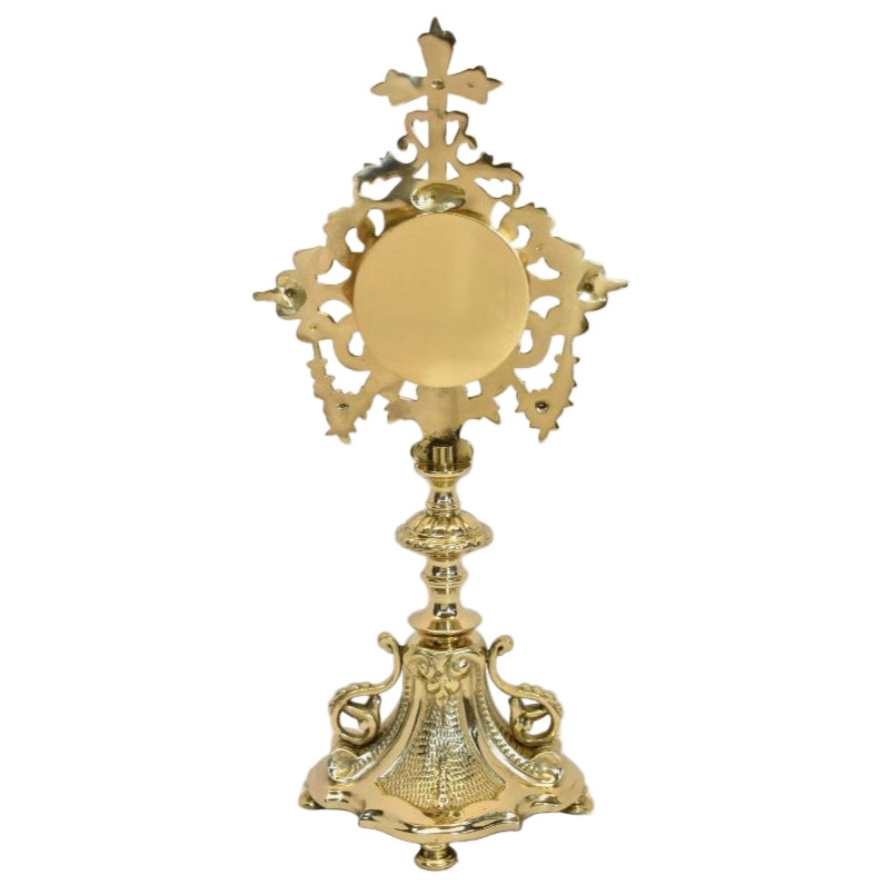 French filigree baroque style reliquary. Polished brass and lacquered. Glass on front with round removable door on the back to house your relic. 