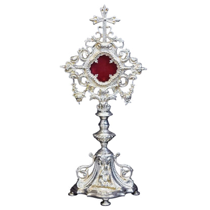 Silver plated french baroque style reliquary. Glass on front and removable glass door to house your relic. 