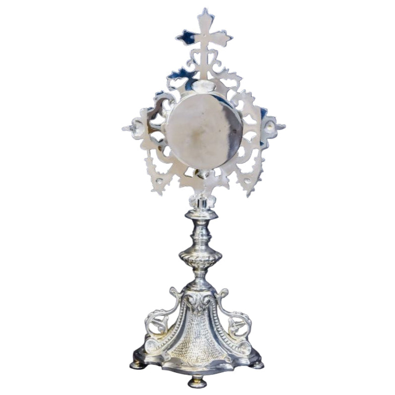 Silver plated french baroque style reliquary. Glass on front and removable glass door to house your relic. 