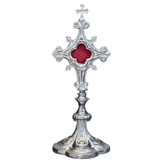 Silver plated French style fleur de lis cross reliquary with a clear front glass and removable back door.