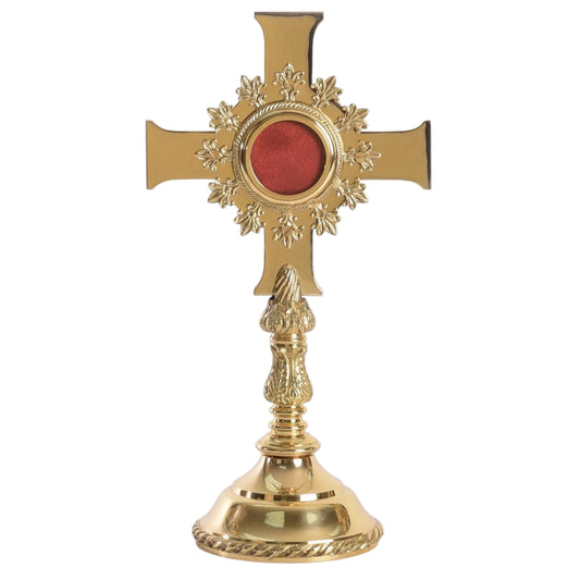 Brass cross-shaped reliquary with a polished finish and a relic compartment visible at the top. Removable back door