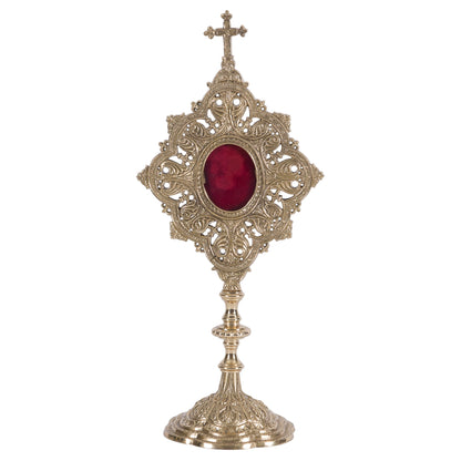 Ornate filigree reliquary in a polished brass and lacquered finish. Glass on the front and a removable door to house your relic. 
FRONT VIEW