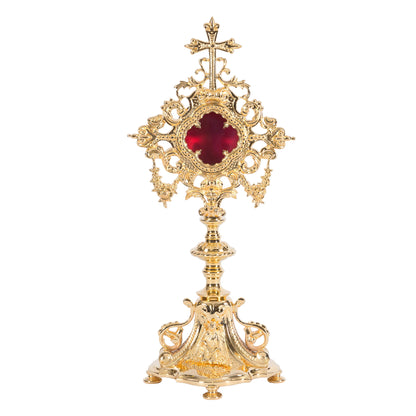 Gold plated french baroque style reliquary with glass on the front and a removable back door to house your relic. 