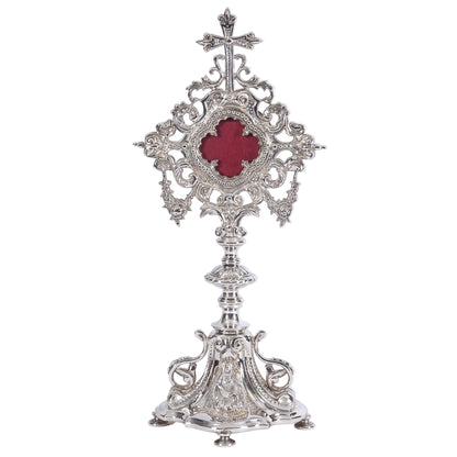 Silver plated french baroque style reliquary. Glass on front and removable glass door to house your relic. 