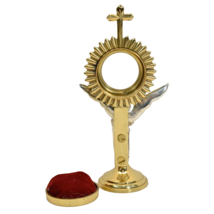 Brass Rays reliquary with a beautiful Silver plated standing Angel figure as the stem. Glass on front and removable back door to house your relic. 
back view showing the door removed