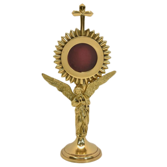 Polished brass and lacquered rays reliquary with standing Angel figure as the stem. Glass on front and removable back door. Front view.